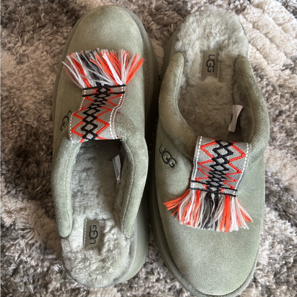UGG Kids Olive Suede Slip-Ons with Orange Fringe Detail